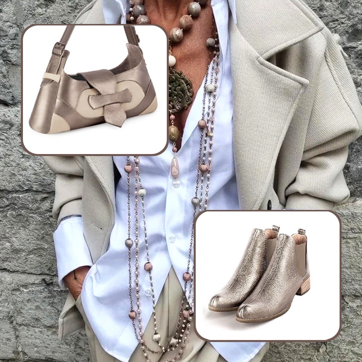 Women's elegant ankle boots, with elastics on the sides, and medium luxurious handbag to pair with an antique gold and bronze beige outfit.