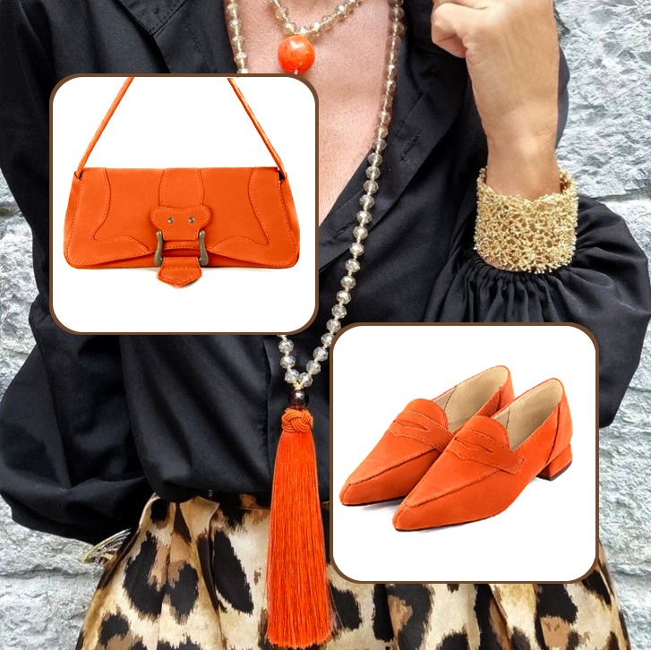 Women's classic elegant loafers and small luxurious handbag to pair with a clementine orange outfit.