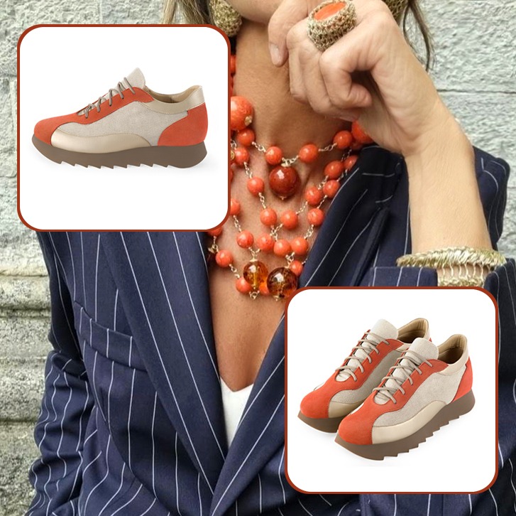Women's elegant urban sneakers and luxurious clutch for ceremonies to pair with a terracotta orange and gold outfit.