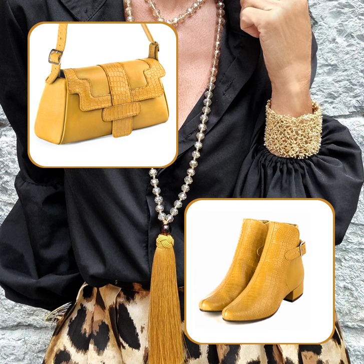 Women's elegant ankle boots, with buckles at the back, and medium luxurious handbag to pair with a mustard yellow outfit.