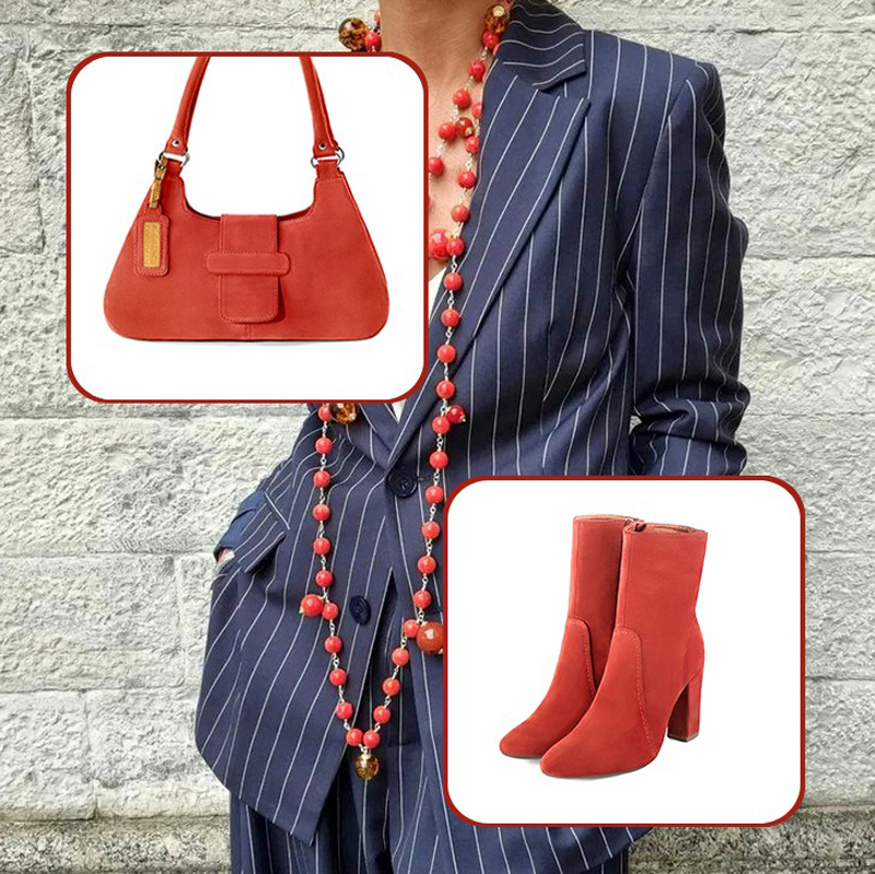Women's elegant ankle boots, with a zip on the inside, and medium luxurious handbag to pair with a scarlet red outfit.