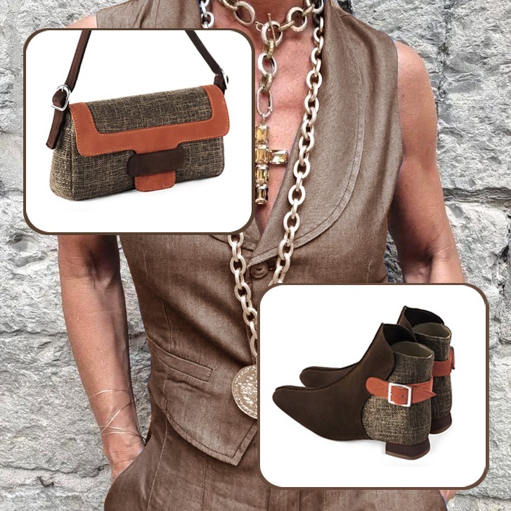 Women's dress ankle boots back buckles and small handbag paired to a dark brown and terracotta orange outfit.