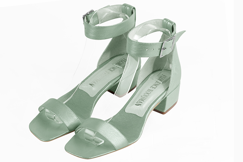 Mint green women's closed back sandals, with a strap around the ankle. Square toe. Low block heels. Front view - Florence KOOIJMAN