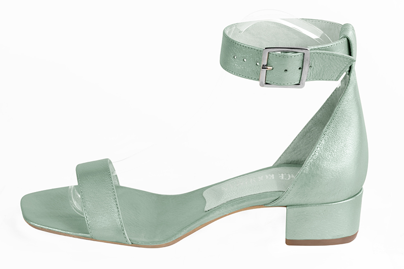 Mint green women's closed back sandals, with a strap around the ankle. Square toe. Low block heels. Profile view - Florence KOOIJMAN