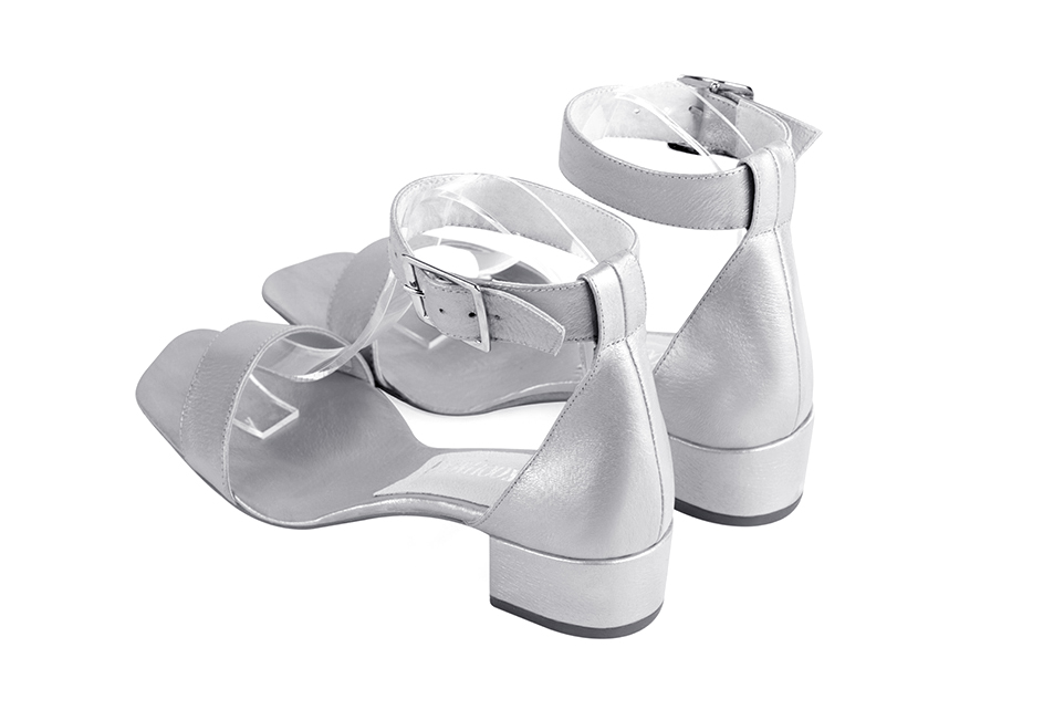 Women's silver ankle strap dress sandals. Square toe. Low block heels - Rear view