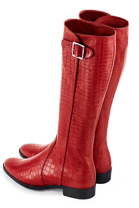French elegance and refinement for these scarlet red knee-high boots with buckles, 
                available in many subtle leather and colour combinations. Record your foot and leg measurements.
We will adjust this beautiful boot with inner half zip to your leg measurements in height and width.
The outer buckle allows for width adjustment.
You can customise the boot with your own materials and colours on the "My Favourites" page.
 
                Made to measure. Especially suited to thin or thick calves.
                Matching clutches for parties, ceremonies and weddings.   
                You can customize these knee-high boots to perfectly match your tastes or needs, and have a unique model.  
                Choice of leathers, colours, knots and heels. 
                Wide range of materials and shades carefully chosen.  
                Rich collection of flat, low, mid and high heels.  
                Small and large shoe sizes - Florence KOOIJMAN