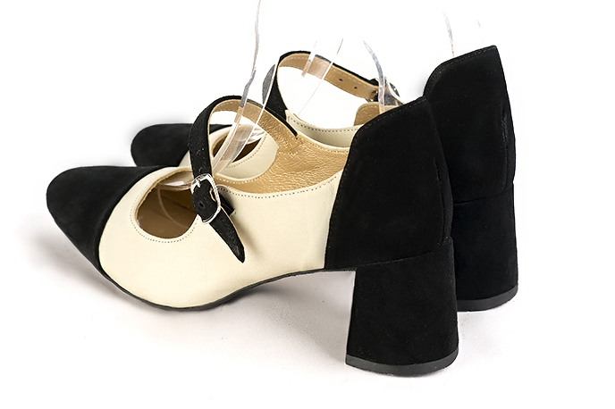 Matt black and off white women's dress pumps, with a round neckline. Round toe. Medium flare heels. Rear view - Florence KOOIJMAN