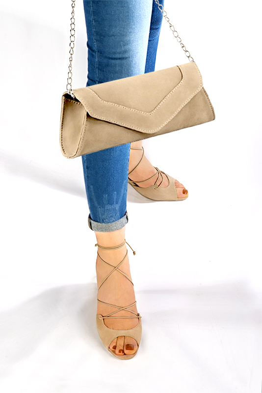 Sand beige women's closed back sandals, with crossed straps. Round toe. High kitten heels. Worn view - Florence KOOIJMAN