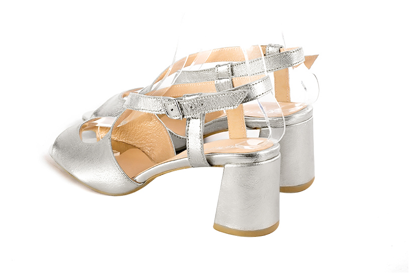 Light silver women's open back sandals, with crossed straps. Round toe. Medium flare heels. Rear view - Florence KOOIJMAN