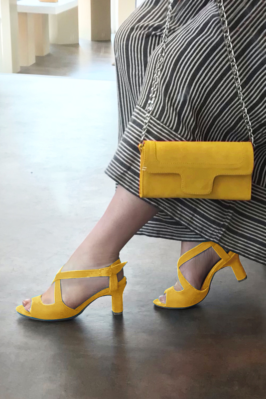 Yellow women's open back sandals, with crossed straps. Round toe. High kitten heels. Worn view - Florence KOOIJMAN
