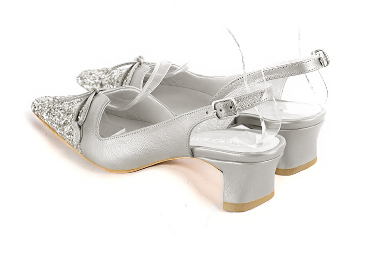 Light silver women's open back shoes, with a knot. Tapered toe. Low kitten heels. Rear view - Florence KOOIJMAN