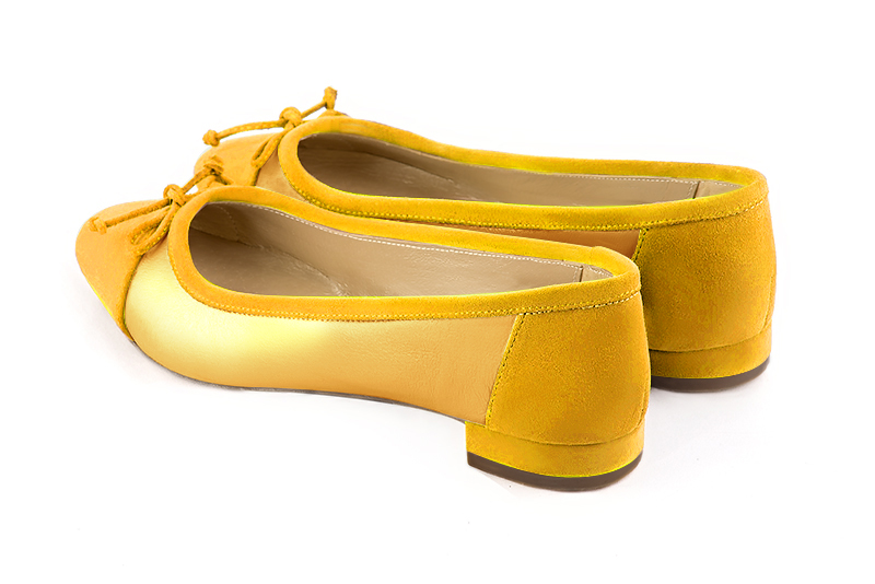 Yellow women's ballet pumps, with low heels. Round toe. Flat block heels. Rear view - Florence KOOIJMAN