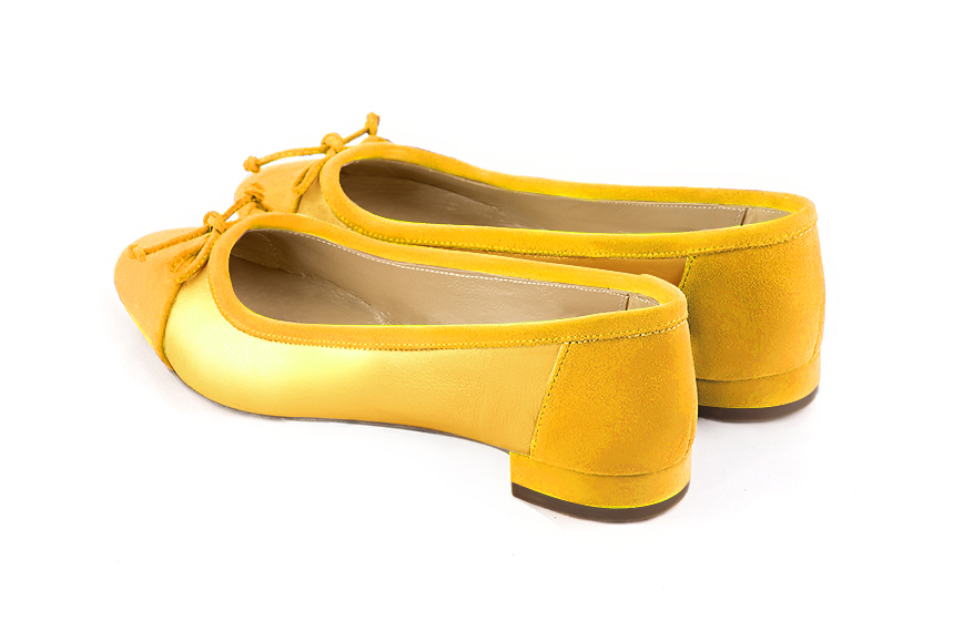 Yellow women's ballet pumps, with low heels. Round toe. Flat block heels. Rear view - Florence KOOIJMAN