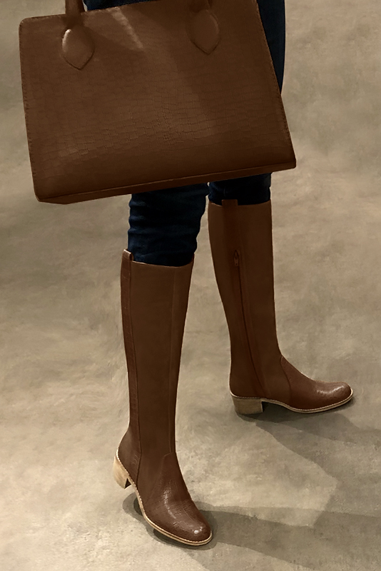 Custom-made women's caramel brown elegant riding knee-high boots. Round toe. Thick leather soles - Worn view