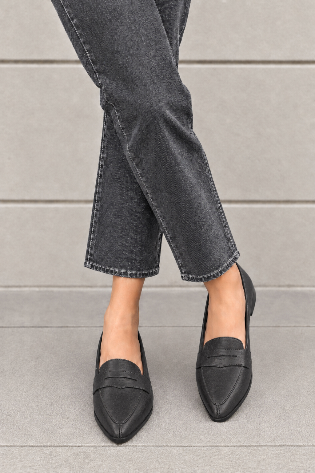 Women's charcoal gray classic penny loafers with almond toe and chunky rubber lug sole - Worn view