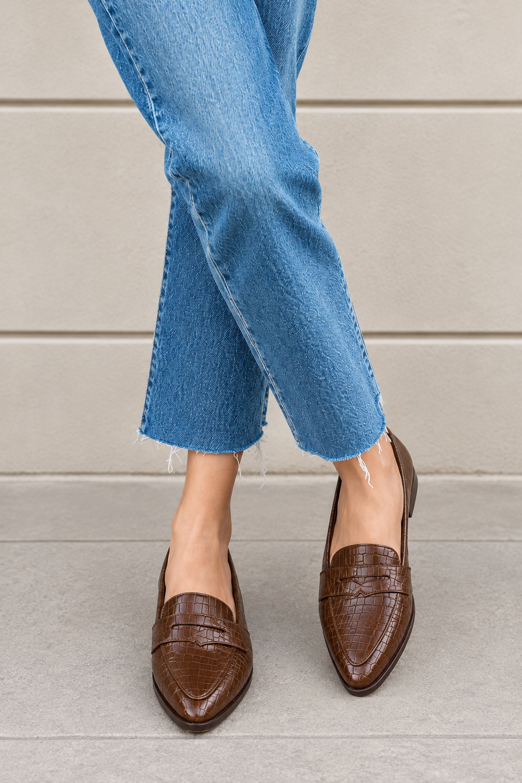 Women's cognac classic penny loafers with almond toe and chunky rubber lug sole - Worn view