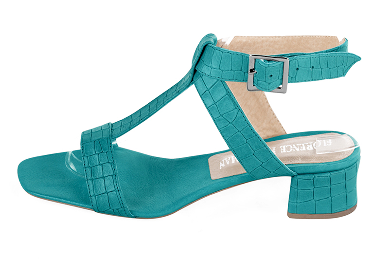 Turquoise blue women's fully open sandals, with an instep strap. Square toe. Low flare heels. Profile view - Florence KOOIJMAN