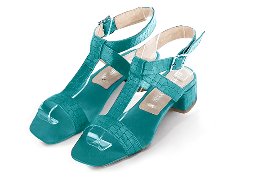 Turquoise blue women's fully open sandals, with an instep strap. Square toe. Low flare heels. Front view - Florence KOOIJMAN