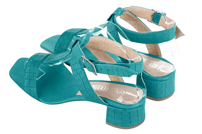 Turquoise blue women's fully open sandals, with an instep strap. Square toe. Low flare heels. Rear view - Florence KOOIJMAN