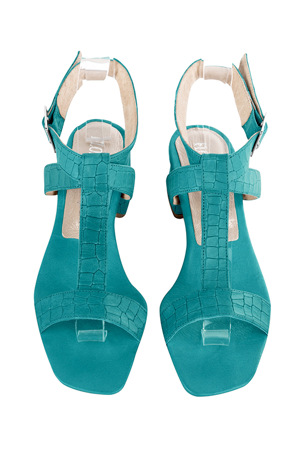 Dress sandals instep strap fully open in turquoise blue leather with low flare heels and square toe - Top view