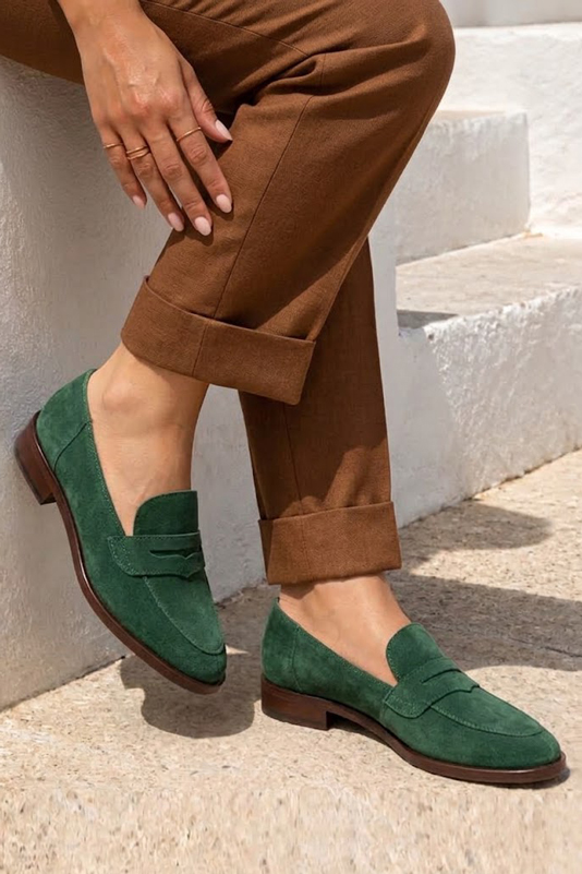 Women's forest green lug-sole loafers with round toe and chunky rubber lug sole - Worn view