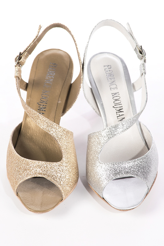Light silver women's open back sandals, with crossed straps. Round toe. Medium spool heels. Worn view - Florence KOOIJMAN