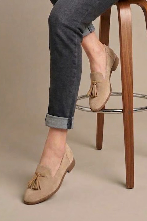 Women's nude and camel tassel loafers with round toe and chunky rubber lug sole - Worn view
