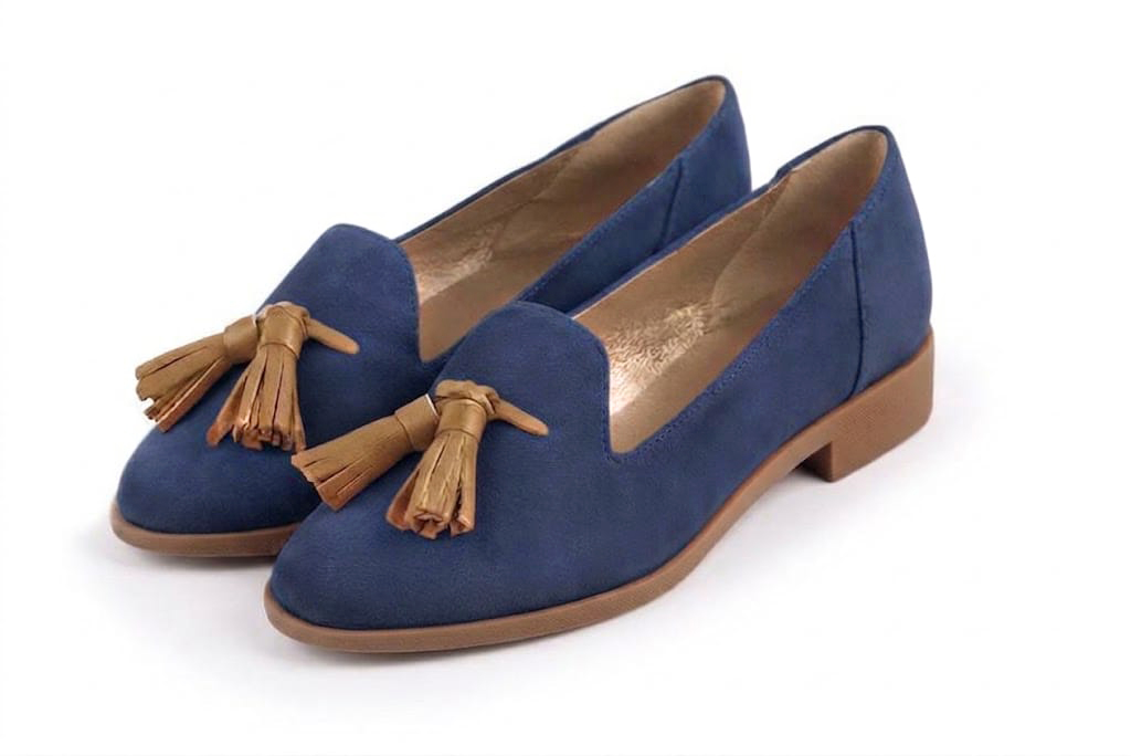 Sophisticated women's tassel loafers finished with delicate leather details, designed for polished business and casual elegance, in indigo blue and camel leather with round toe and chunky rubber lug sole