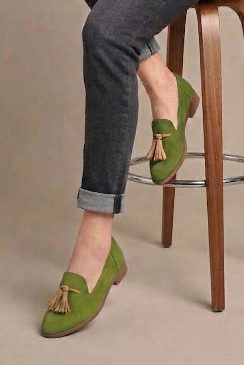 Women's pistachio green and camel tassel loafers with round toe and chunky rubber lug sole - Worn view