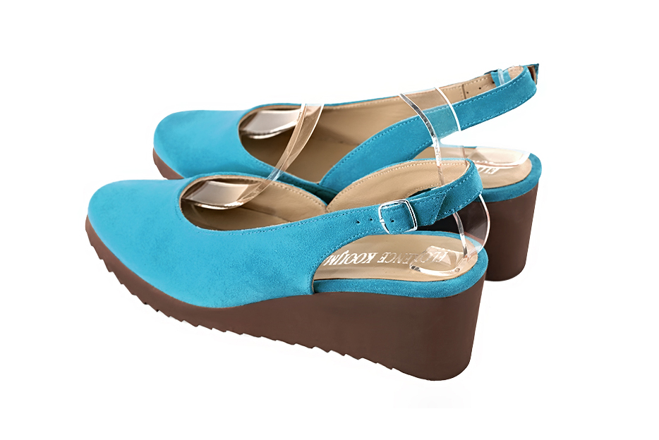 French elegance and refinement for these turquoise blue dress slingback shoes, 
                available in many subtle leather and colour combinations.   
                Matching clutches for parties, ceremonies and weddings.   
                You can customize these shoes to perfectly match your tastes or needs, and have a unique model.  
                Choice of leathers, colours, knots and heels. 
                Wide range of materials and shades carefully chosen.  
                Rich collection of flat, low, mid and high heels.  
                Small and large shoe sizes - Florence KOOIJMAN