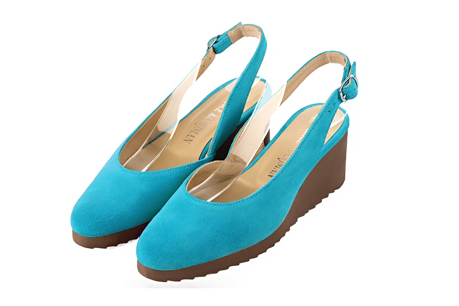 French elegance and refinement for these turquoise blue dress slingback shoes, 
                available in many subtle leather and colour combinations.   
                Matching clutches for parties, ceremonies and weddings.   
                You can customize these shoes to perfectly match your tastes or needs, and have a unique model.  
                Choice of leathers, colours, knots and heels. 
                Wide range of materials and shades carefully chosen.  
                Rich collection of flat, low, mid and high heels.  
                Small and large shoe sizes - Florence KOOIJMAN