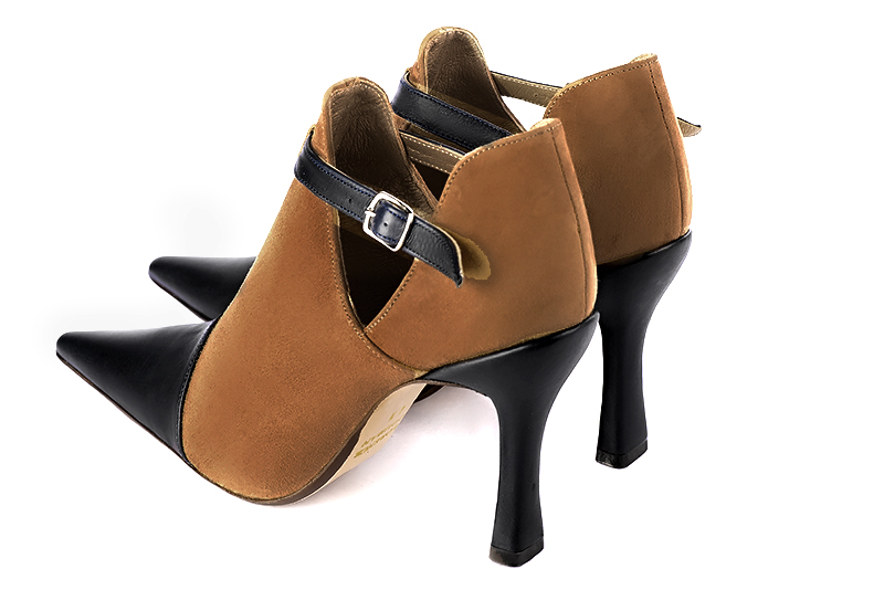 Women's satin black and caramel brown elegant ankle boots, with buckles on the sides. Pointed toe. High spool heels - Rear view
