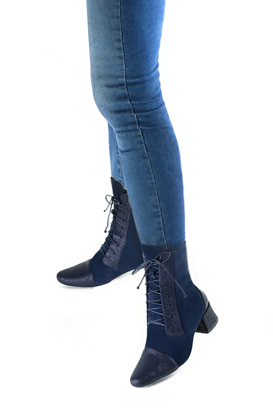 Navy blue women's ankle boots with laces at the front. Round toe. Low flare heels. Worn view - Florence KOOIJMAN