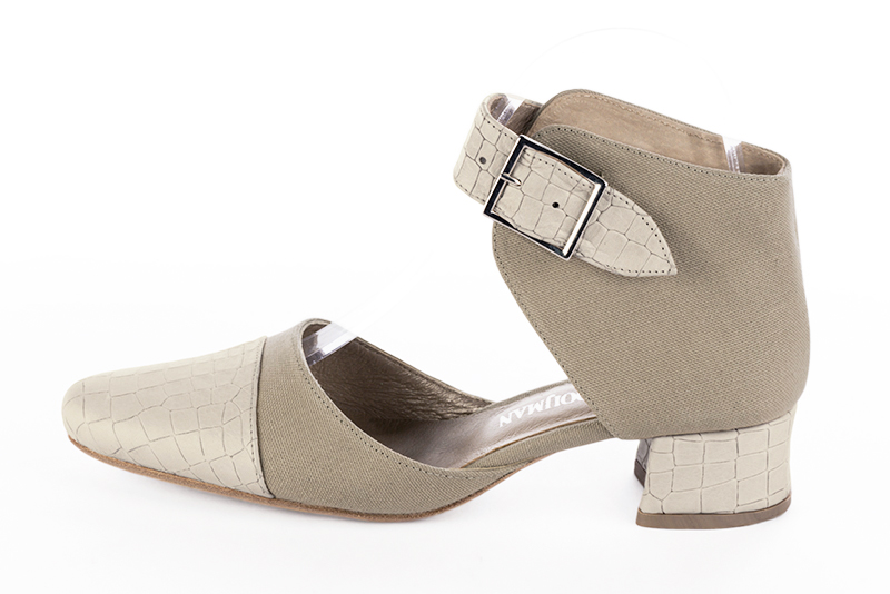 Off white and natural beige women's open side shoes, with a strap around the ankle. Round toe. Low flare heels. Profile view - Florence KOOIJMAN
