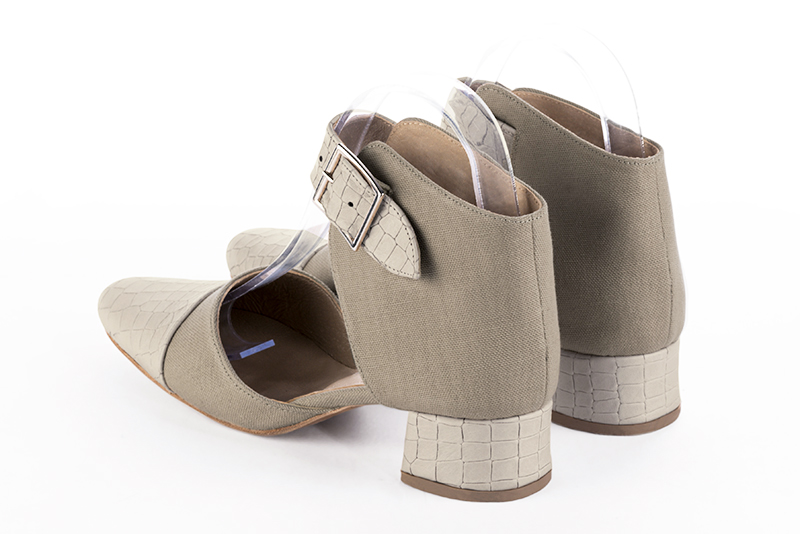 Off white and natural beige women's open side shoes, with a strap around the ankle. Round toe. Low flare heels. Rear view - Florence KOOIJMAN