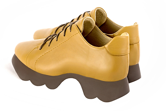 Mustard yellow women's casual lace-up shoes.. Rear view - Florence KOOIJMAN