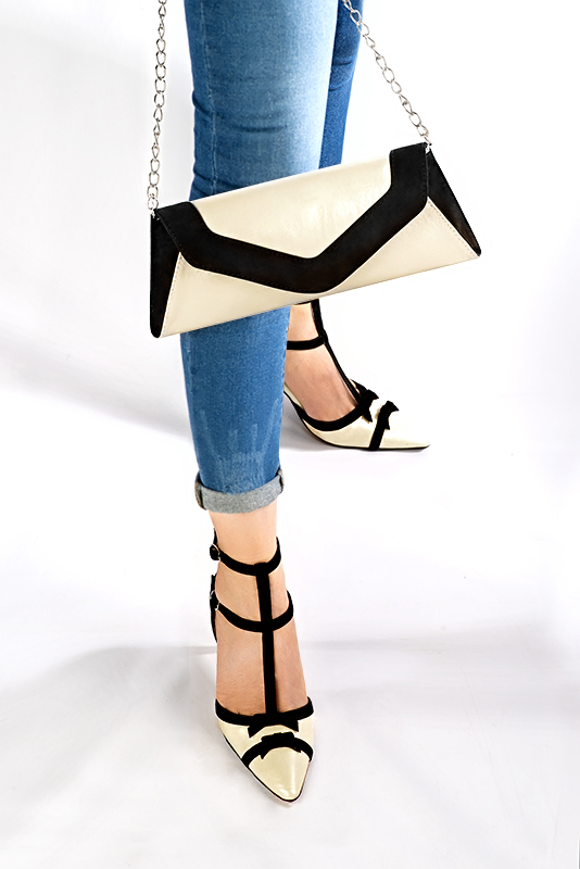 Off white and matt black women's open back T-strap shoes. Tapered toe. High slim heel. Worn view - Florence KOOIJMAN